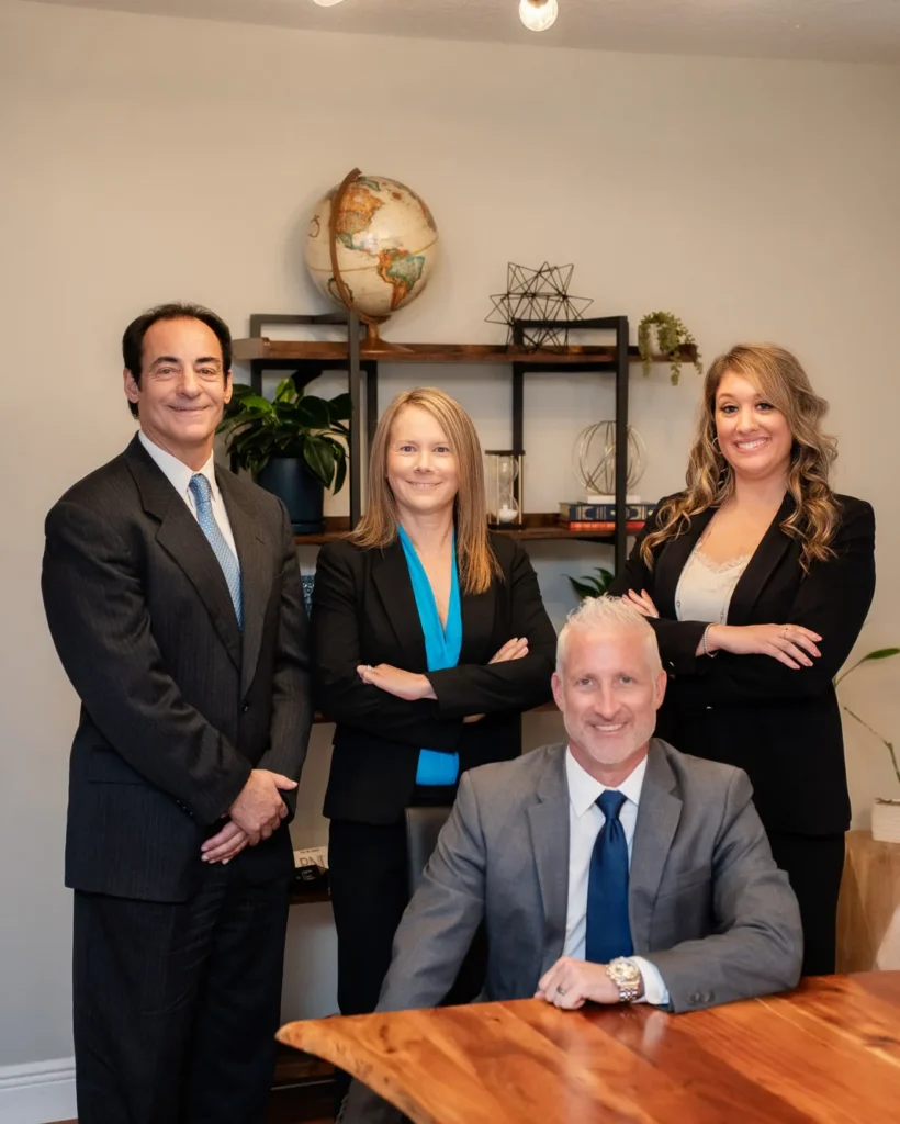 Bruce Fertel, Erin Catey, Lynna Comunale and Jonathan Maguire, the four attorneys at Catey & Maguire Law in New Port Richey, Florida
