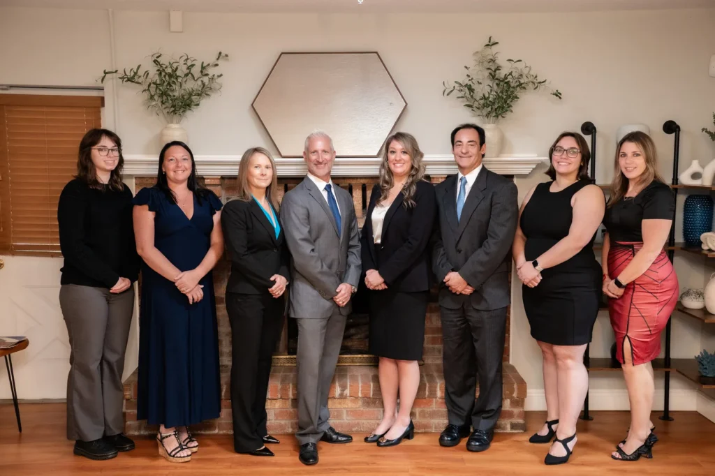 The attorneys and staff of Catey & Maguire Law at their office in New Port Richey, Florida