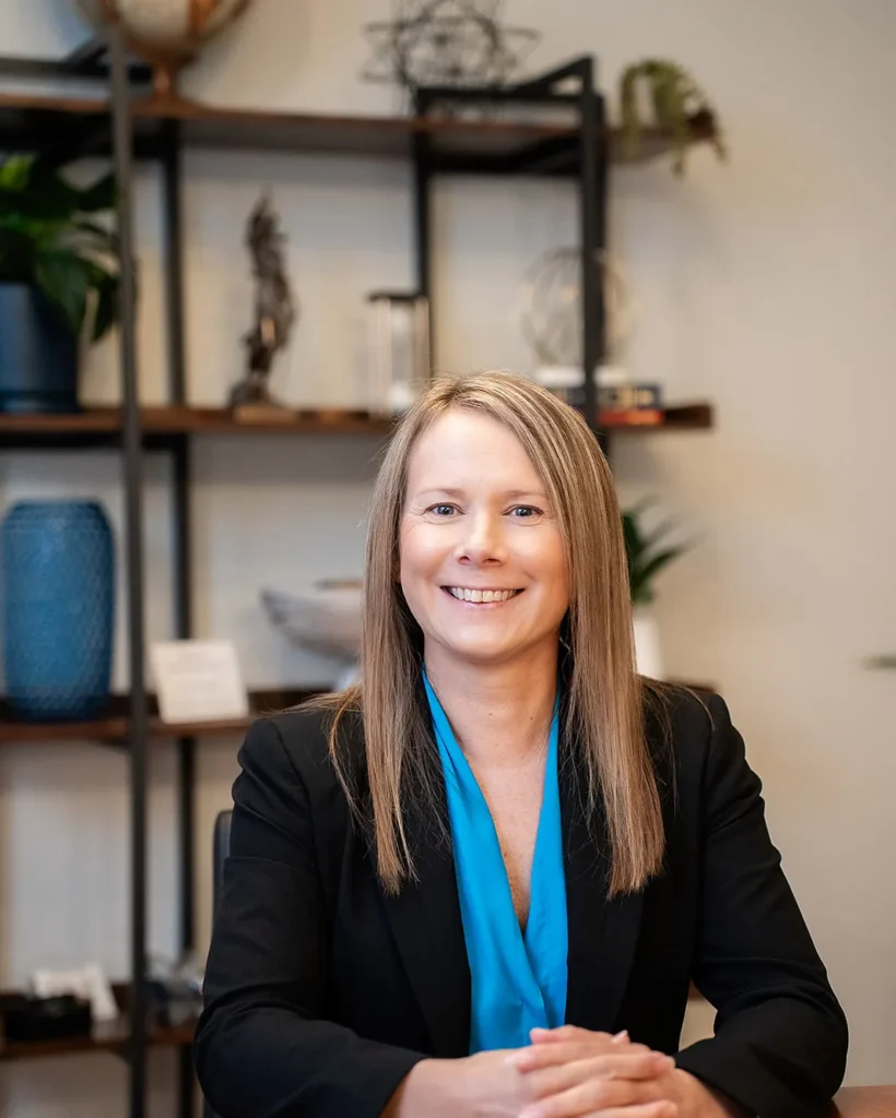 Erin Catey, managing partner, family law attorney and Florida Supreme Court family law mediator, at the conference table at Catey & Maguire Law in New Port Richey, Florida