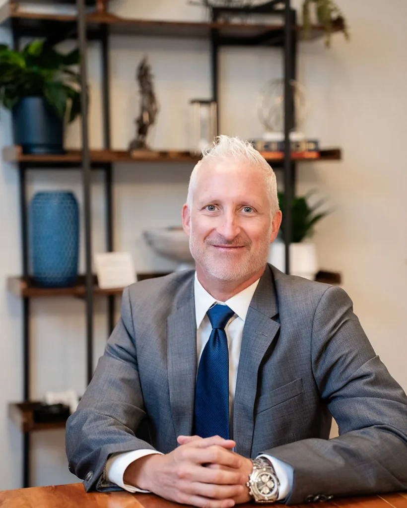 Jonathan Maguire, partner and family law and criminal defense litigation attorney, at the conference table at Catey & Maguire Law in New Port Richey, Florida